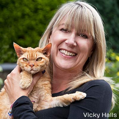 Vicky Halls with a ginger cat.