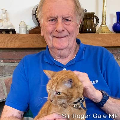 Sir Roger Gale MP with a ginger cat.